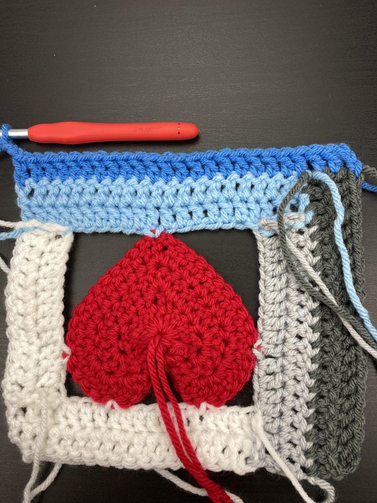 sixth panel of the log cabin love block